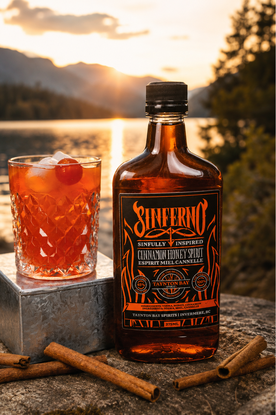 Bottle of Sinefrno whiskey and a cocktail by a lake at sunset
